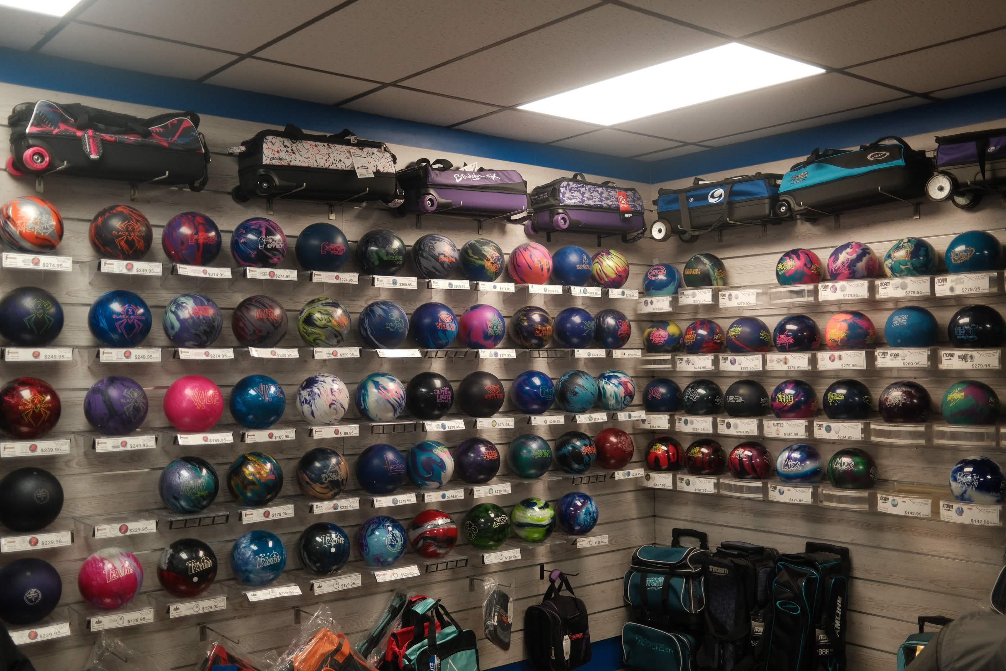 Bowling balls displayed on the pro shop wall